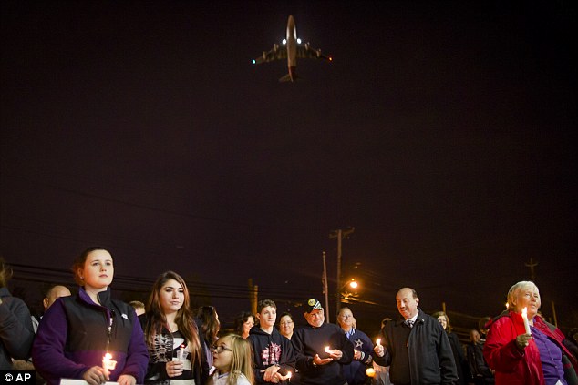 Breezy Point residents held their candlelight vigil in West Hamilton, NY. Photo credit: AP