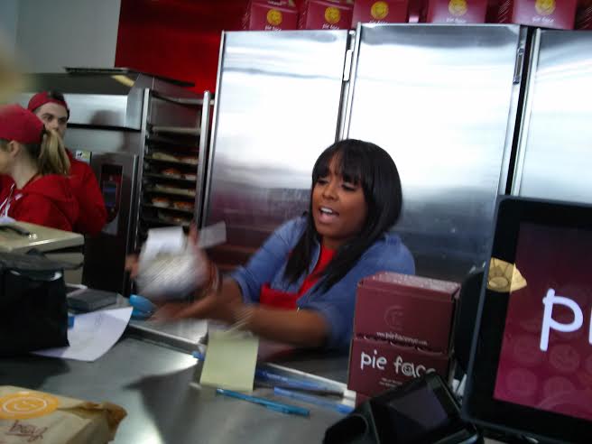 Keshia Knight Pulliam ringing people up. She worked hard for Kamp Kizzy. Image Courtesy: Moi