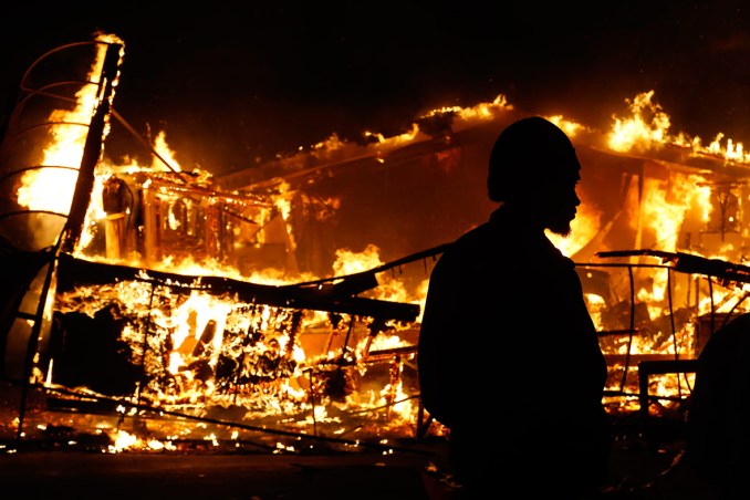  A burning building in Ferguson. Image Courtesy of Jim Young Reuters