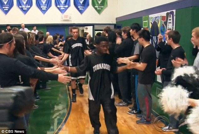 The Gainesville Texas  Tornadoes make a surprising entrance into the game. Photo courtesy:  CBS News