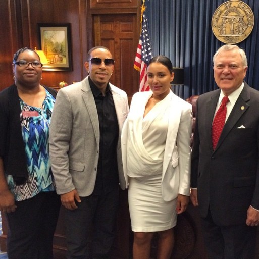 Ludacris surrounded by lawmakers and pregnant wife Eudoxie. Photo Courtesy: ludacrisfdtn instagram